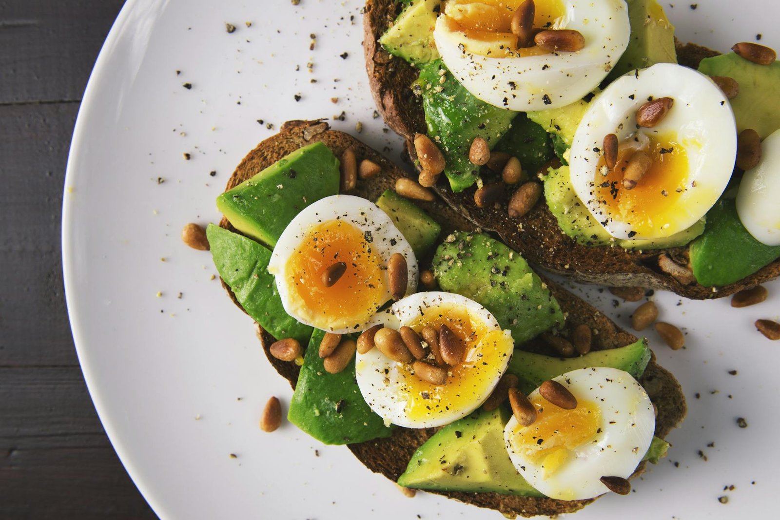 Healthy breakfast with boiled eggs and avocado